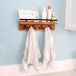 "Wall-mounted key holder Wooden mail organizer Entryway storage solution Key hooks with shelf Rustic modern home decor"