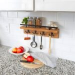 "Wall-mounted key holder Wooden mail organizer Entryway storage solution Key hooks with shelf Rustic modern home decor"