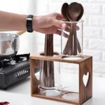 "Rustic utensil holder Wooden and glass kitchen organizer Heart-cut design utensil holder Farmhouse-style utensil rack Minimalistic kitchen decor"