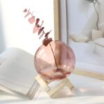 "Modern glass vase with wooden stand Minimalist flower vase Round blush-pink glass vase Contemporary home décor Scandinavian-inspired vases "