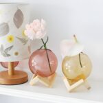"Modern glass vase with wooden stand Minimalist flower vase Round blush-pink glass vase Contemporary home décor Scandinavian-inspired vases "