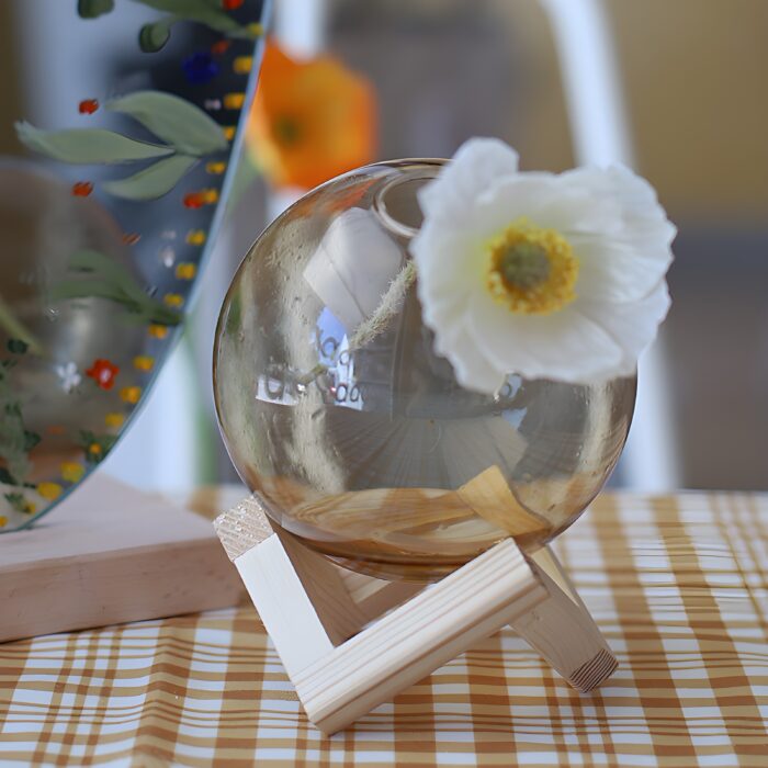 "Modern glass vase with wooden stand Minimalist flower vase Round blush-pink glass vase Contemporary home décor Scandinavian-inspired vases "