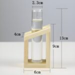 " Minimalist propagation station Modern test tube vase set Plant propagation decor ideas Decorative wooden frame glass vases Angled propagation vase duo"